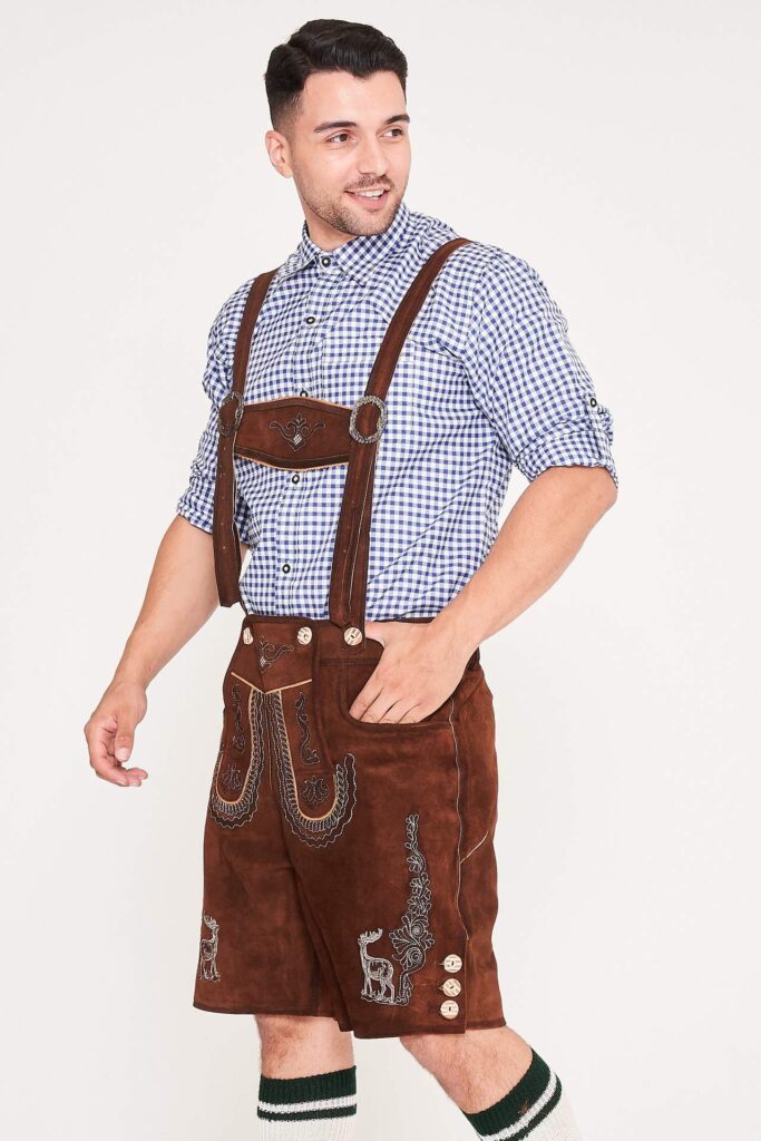 Side view of man in brown embroidered Lederhosen and blue checkered shirt. - Lederhosen For Sale