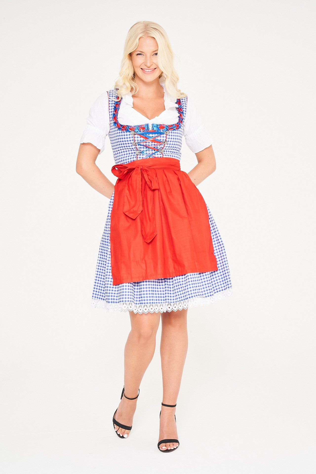 Blonde woman posing in blue checkered Dirndl with red apron. - Lederhosen For Sale