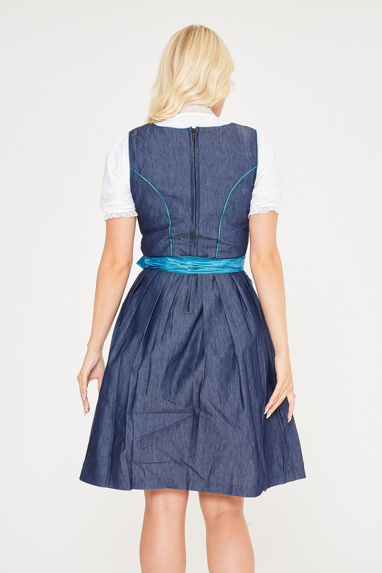 Back view of blonde woman in blue denim Dirndl. - Lederhosen For Sale
