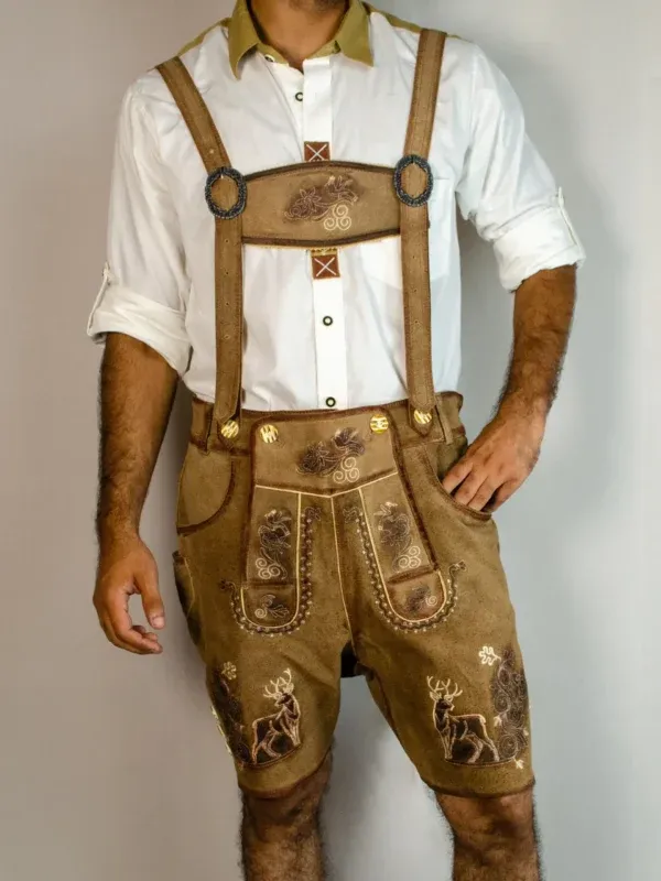 Front view of man in tan embroidered Lederhosen with deer motifs and white shirt. - Lederhosen For Sale