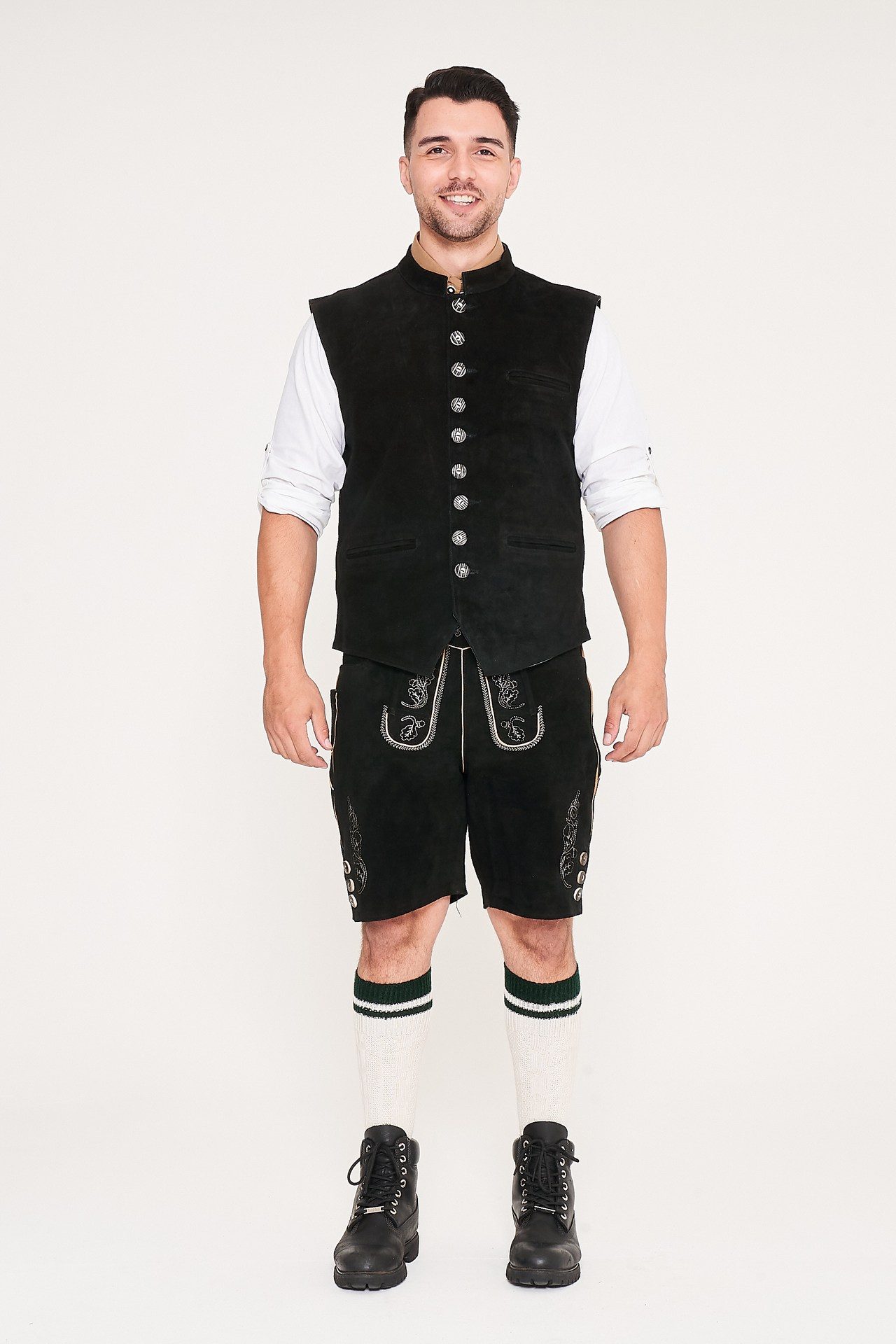 Front view of man standing in black waistcoat, Lederhosen, and white shirt. - Lederhosen For Sale