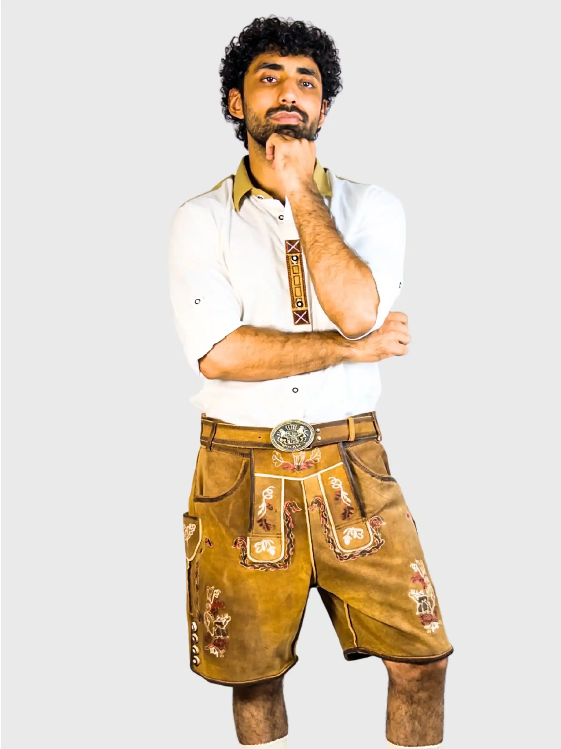 Men's vintage brown leather lederhosen with distressed finish and embroidered detailing